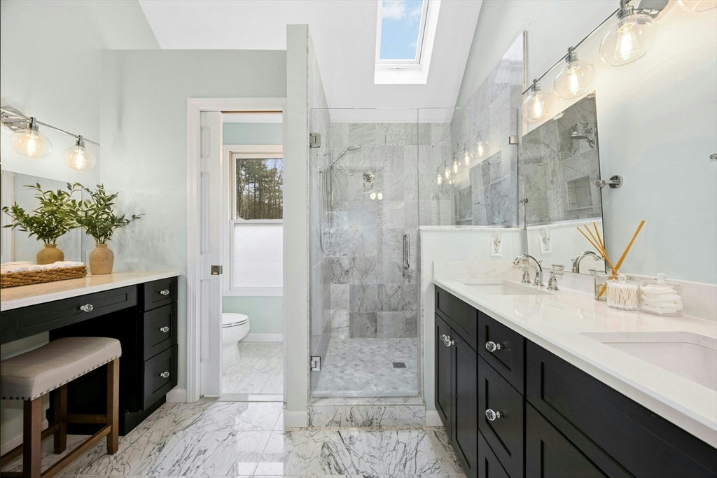 97 Willow Brook Road Holden, MA 01520 - Photo 24 of 42 a bathroom with a granite countertop sink a mirror and a shower