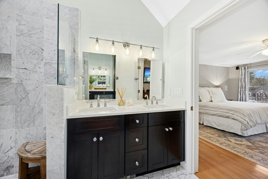 97 Willow Brook Road Holden, MA 01520 - Photo 25 of 42 a en suite bathroom with a double vanity sink and a mirror