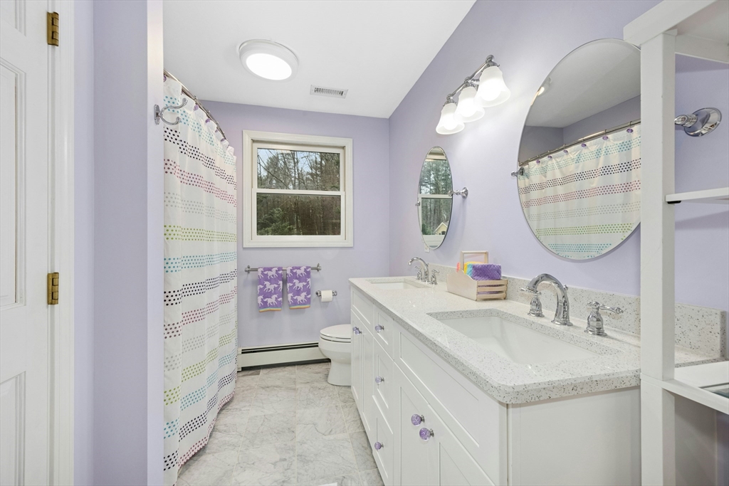 97 Willow Brook Road Holden, MA 01520 - Photo 29 of 42 a bathroom with a sink vanity tub and a mirror