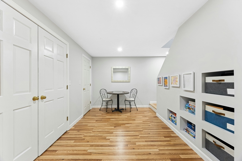 97 Willow Brook Road Holden, MA 01520 - Photo 34 of 42 a hallway with a white stove top oven and furniture
