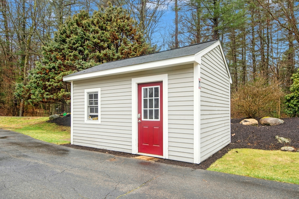 97 Willow Brook Road Holden, MA 01520 - Photo 38 of 42 a view of a house with backyard and trees