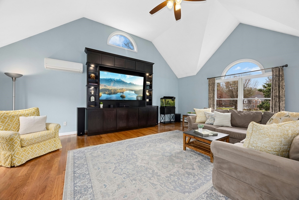 97 Willow Brook Road Holden, MA 01520 - Photo 6 of 42 a living room with furniture and a flat screen tv