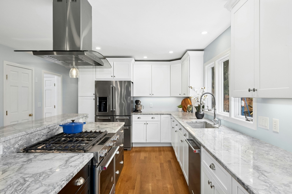 97 Willow Brook Road Holden, MA 01520 - Photo 10 of 42 a kitchen with stainless steel appliances granite countertop a sink stove and refrigerator