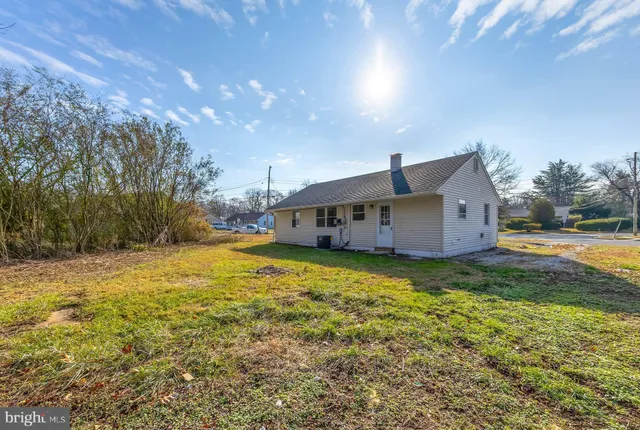 a house view with a big yard