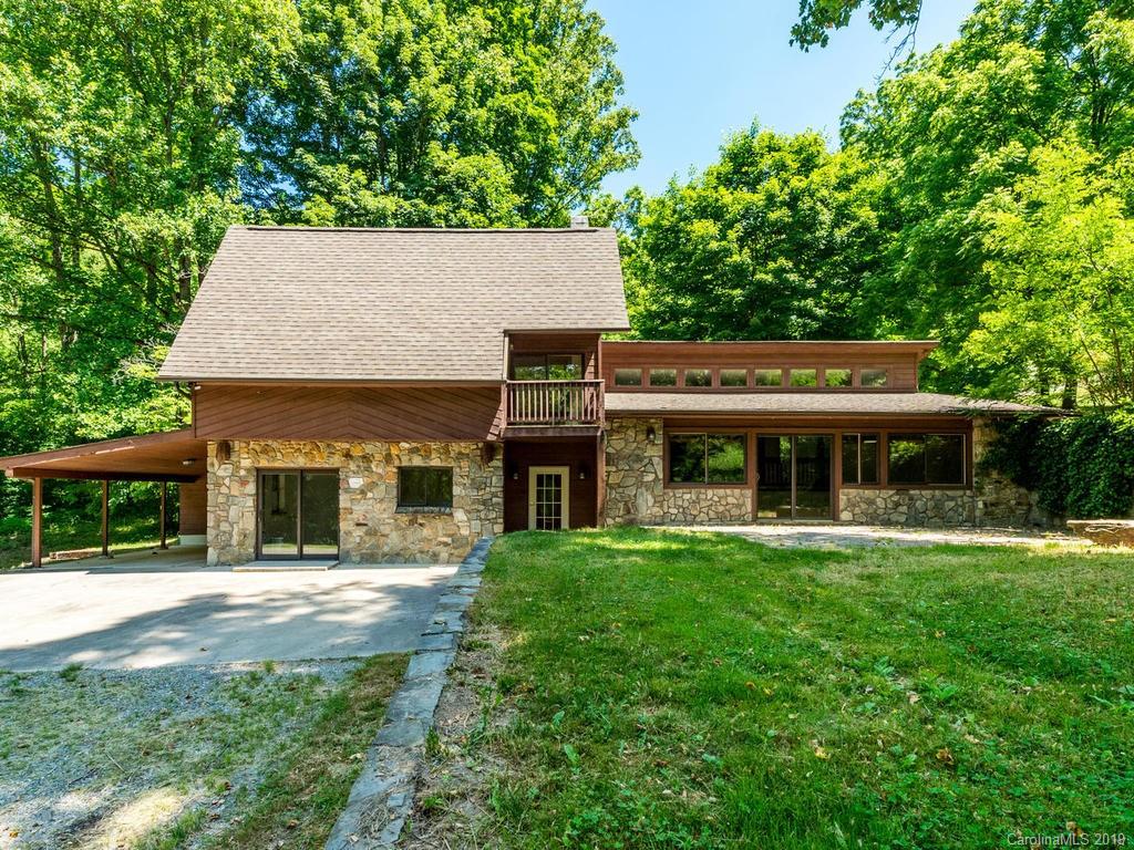 795 Springbrook Farm Road Waynesville, NC 28786 - Photo 1 of 45 a front view of a house with a yard
