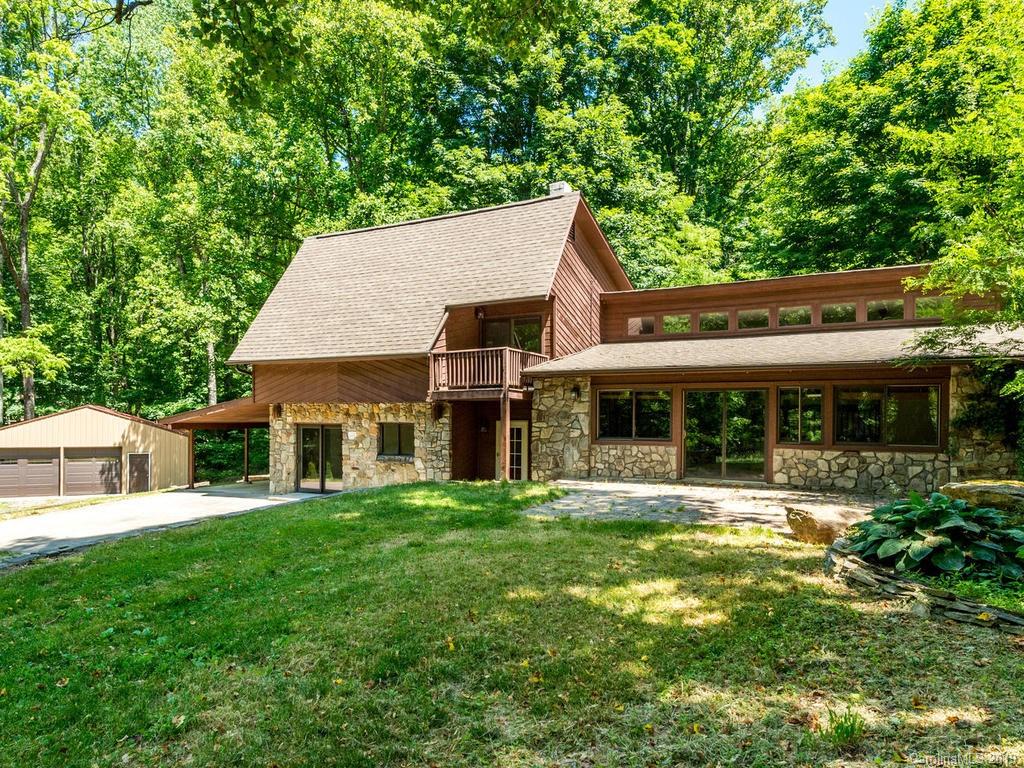 795 Springbrook Farm Road Waynesville, NC 28786 - Photo 2 of 45 a view of a house with a yard and sitting area