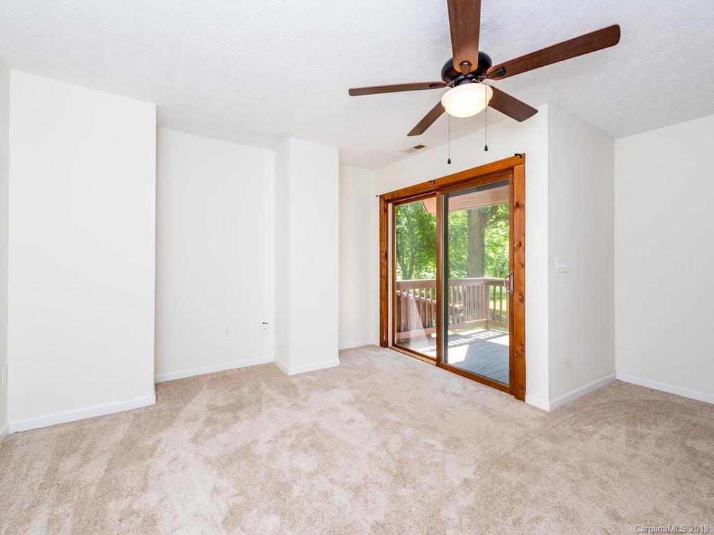795 Springbrook Farm Road Waynesville, NC 28786 - Photo 16 of 45 a view of an empty room with a window