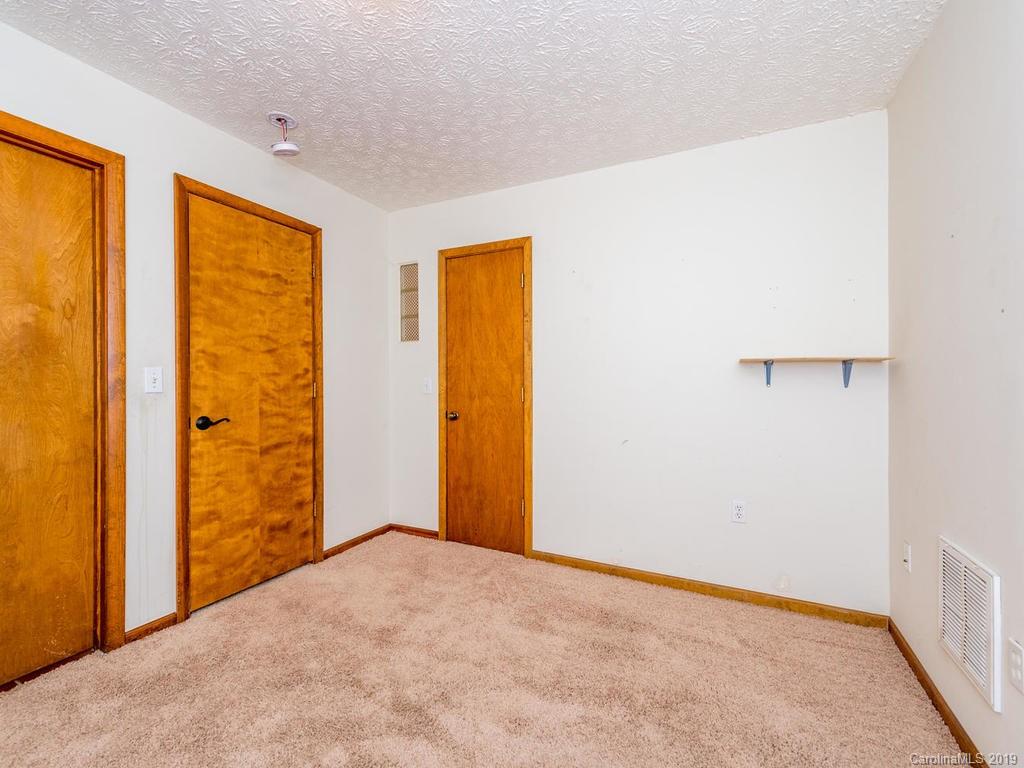 795 Springbrook Farm Road Waynesville, NC 28786 - Photo 27 of 45 a view of an empty room