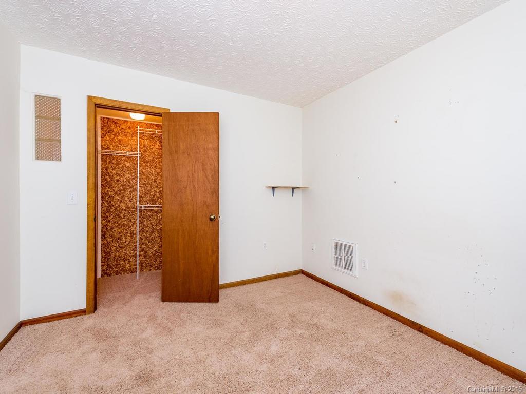 795 Springbrook Farm Road Waynesville, NC 28786 - Photo 28 of 45 an empty room with windows