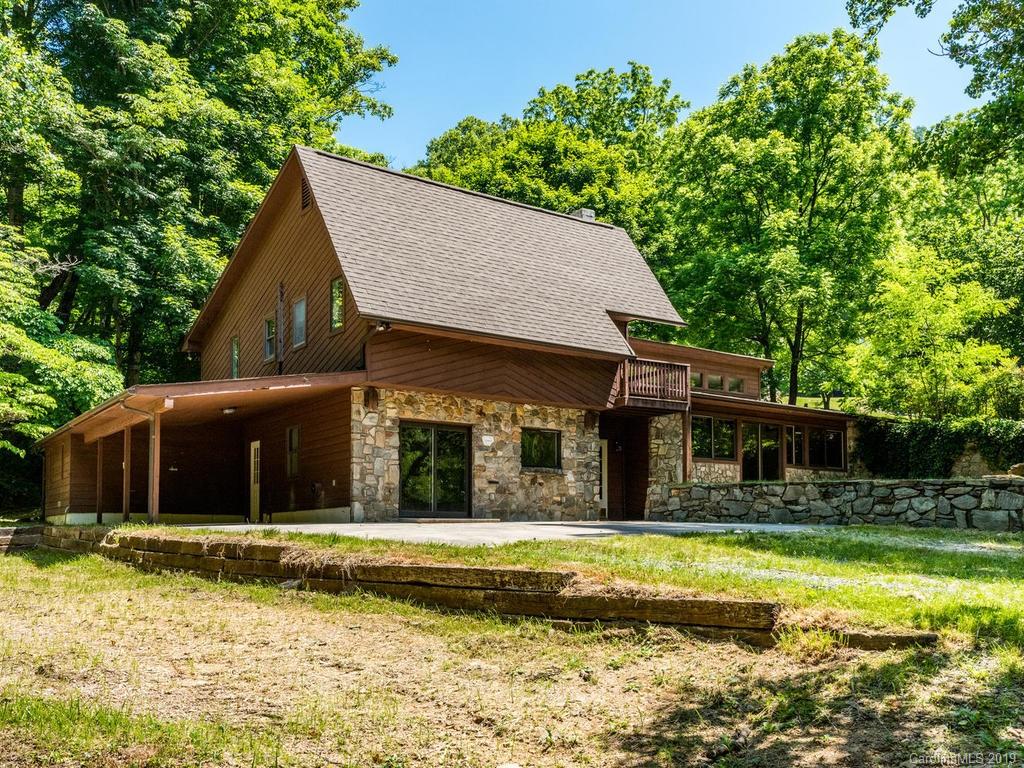 795 Springbrook Farm Road Waynesville, NC 28786 - Photo 31 of 45 a house view with swimming pool in front of it