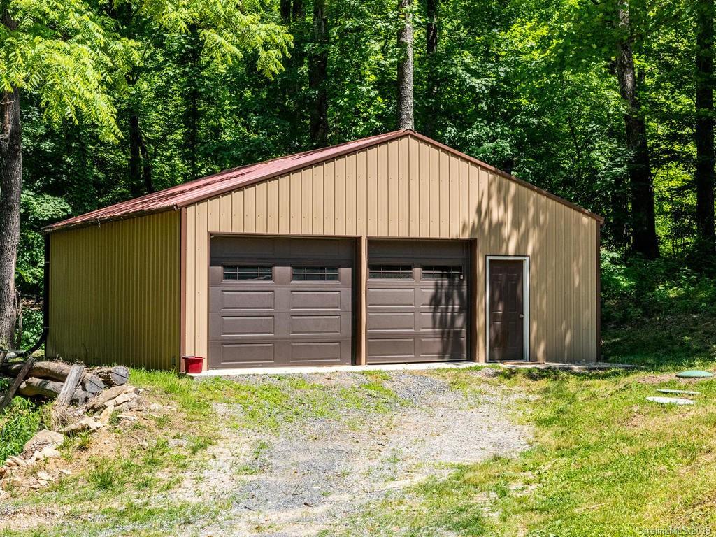 795 Springbrook Farm Road Waynesville, NC 28786 - Photo 33 of 45 a view of a house with yard and large tree