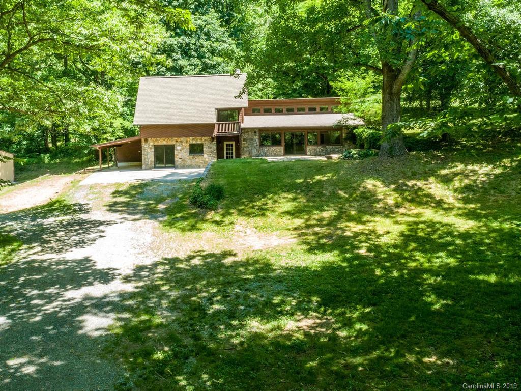 795 Springbrook Farm Road Waynesville, NC 28786 - Photo 37 of 45 a front view of a house with a yard