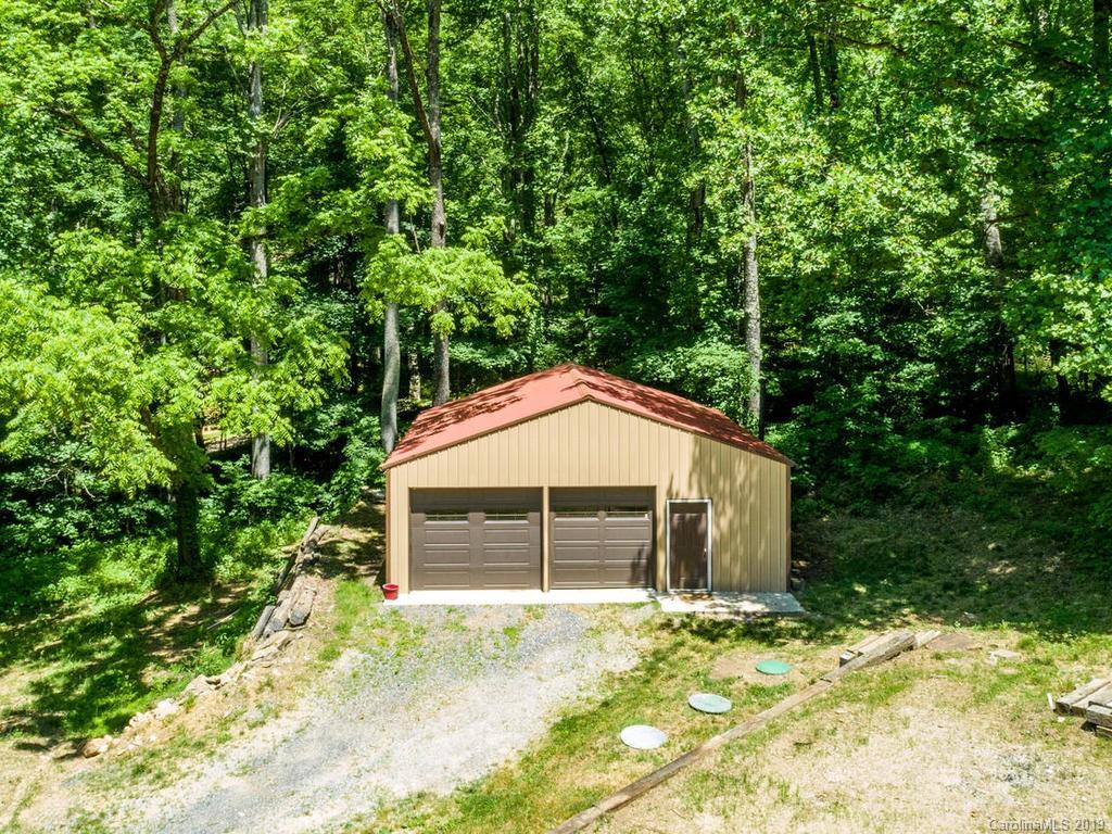 795 Springbrook Farm Road Waynesville, NC 28786 - Photo 39 of 45 a house with trees in front of it
