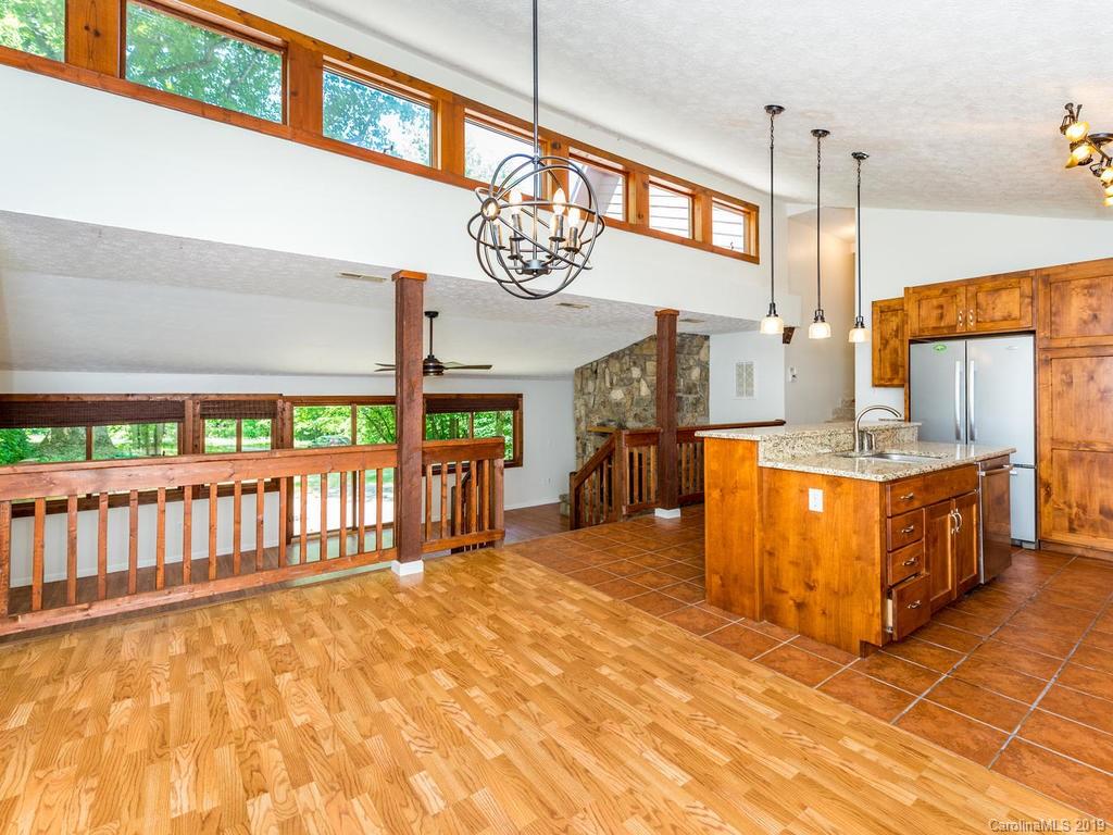 795 Springbrook Farm Road Waynesville, NC 28786 - Photo 9 of 45 a view of a living room and kitchen