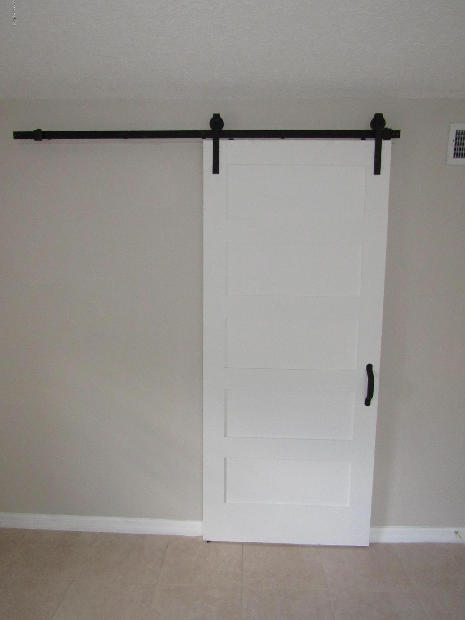 1399 Knecht Road Northeast Palm Bay, FL 32905 - Photo 17 of 35 Master Bath - View of Barn Door