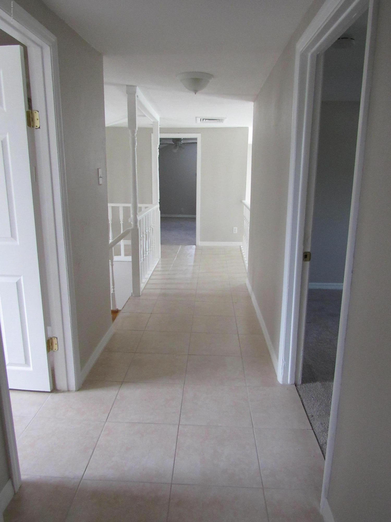 1399 Knecht Road Northeast Palm Bay, FL 32905 - Photo 21 of 35 Upstairs Hallway
