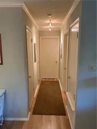 a bedroom with a bed and a workspace