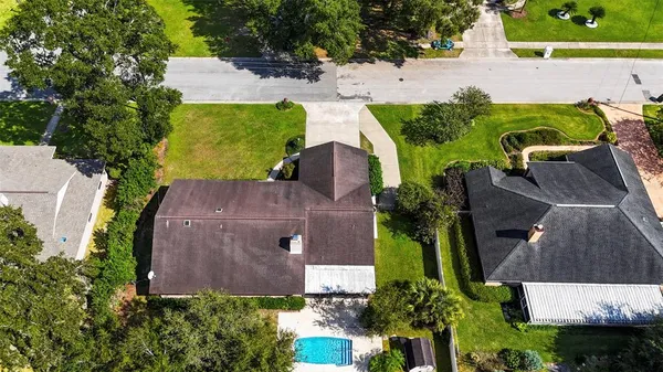 an aerial view of multiple houses with yard