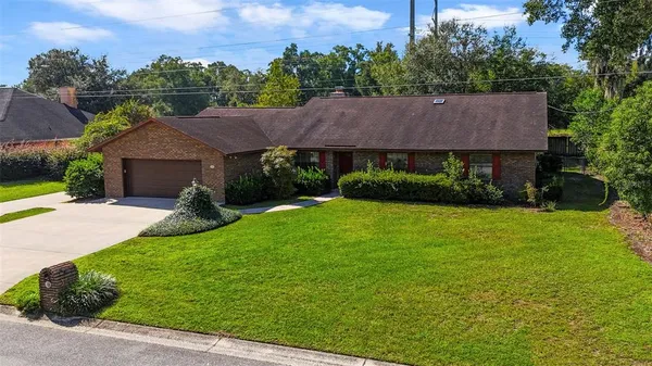 a view of a big yard next to a house