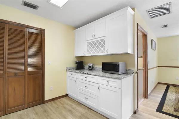 a kitchen with stainless steel appliances a cabinets and a counter space