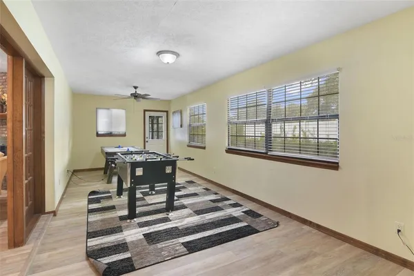 a view of a livingroom with furniture and windows