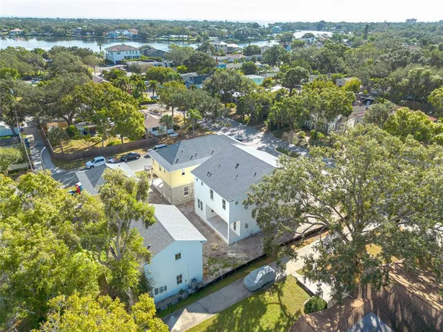 an aerial view of residential houses with outdoor space