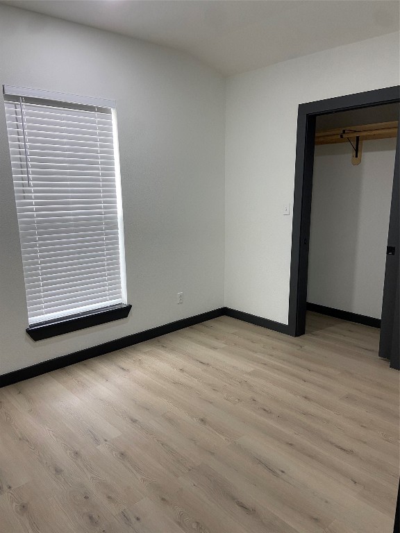 9167 Conner Road Washington, TX 77880 - Photo 13 of 16 an empty room with wooden floor and windows