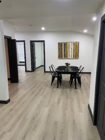 a view of a livingroom with furniture and wooden floor