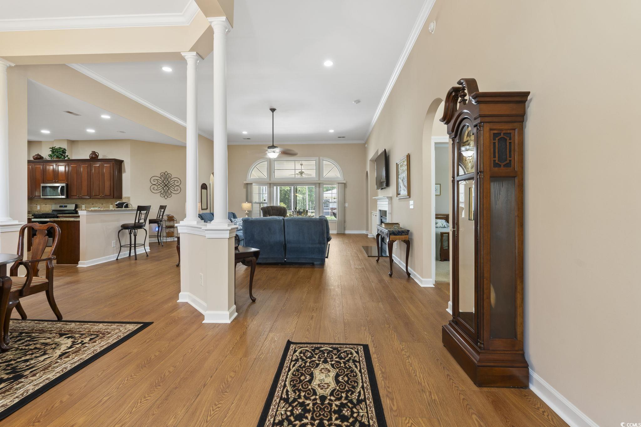 499 Trestle Way Conway, SC 29526 - Photo 4 of 40 Living area with decorative columns, ceiling fan, crown molding, light wood-type flooring, and recessed lighting
