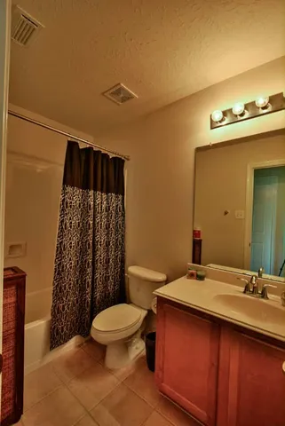 a view of a room with wooden floor and a sink