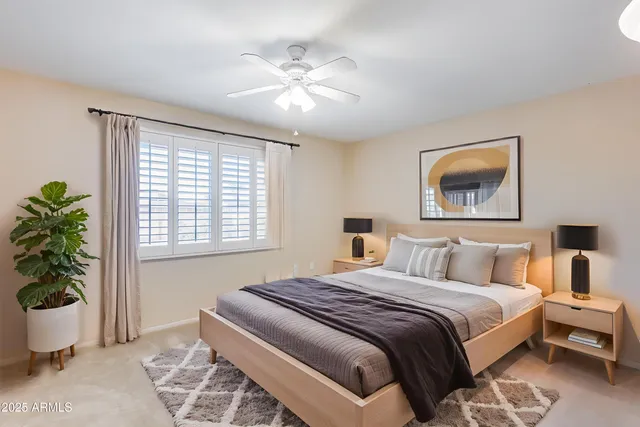 a bedroom with bed and window