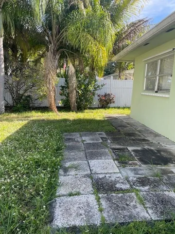 a front view of a house with yard