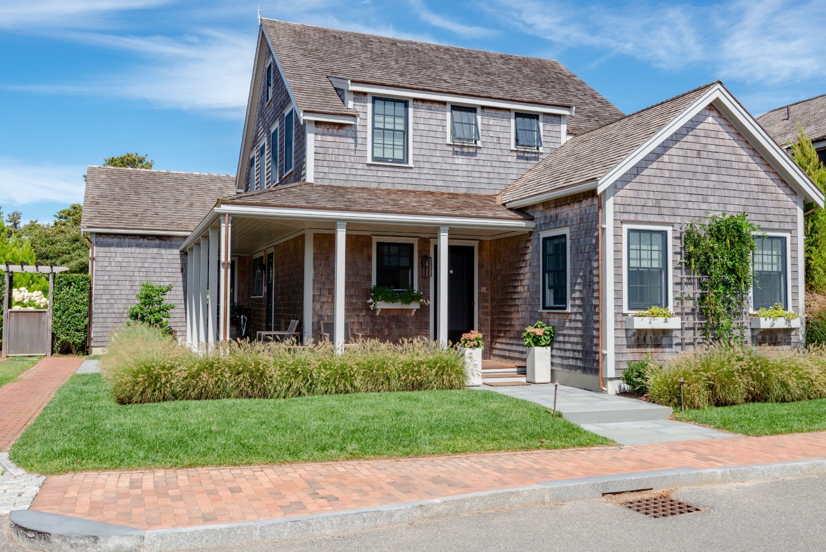 3 Wood Lily Road Nantucket, MA 02554 - Photo 1 of 55 a front view of a house with garden and porch