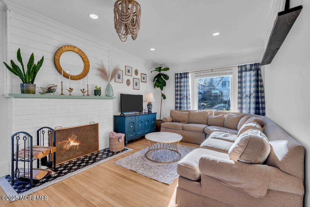 22 Statesir Place Red Bank, NJ 07701 - Photo 11 of 34 a living room with furniture a fireplace and a large window