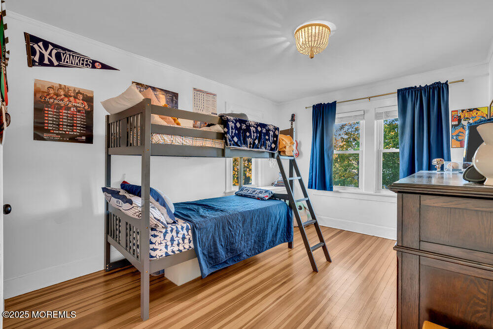 22 Statesir Place Red Bank, NJ 07701 - Photo 16 of 34 a bedroom with furniture and a wooden floor