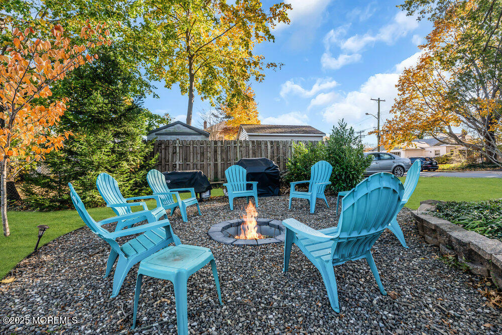 22 Statesir Place Red Bank, NJ 07701 - Photo 23 of 34 a view of a chairs and table in backyard