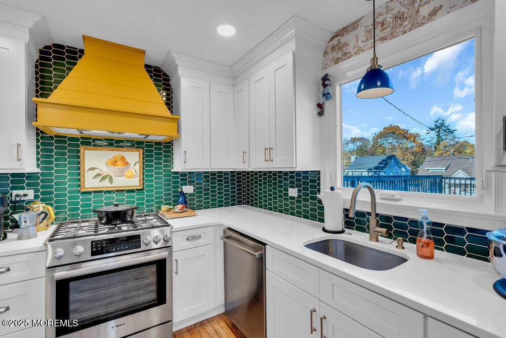 22 Statesir Place Red Bank, NJ 07701 - Photo 7 of 34 a kitchen with a sink cabinets and appliances