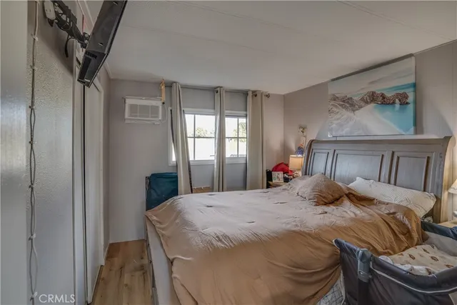 a bedroom with a bed and window