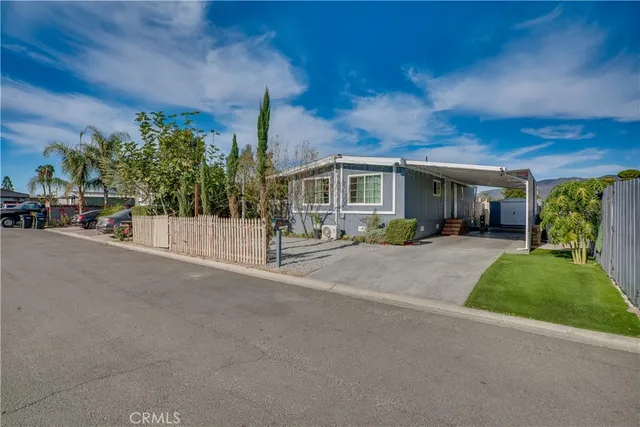 a view of a house with a street