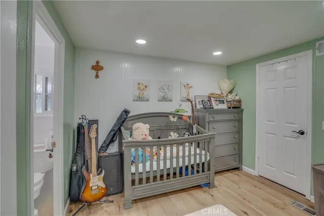 a bedroom with furniture and a window