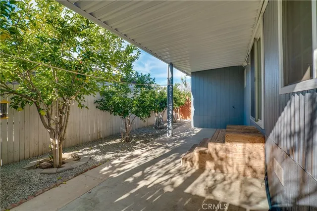 a backyard of a house with a tree