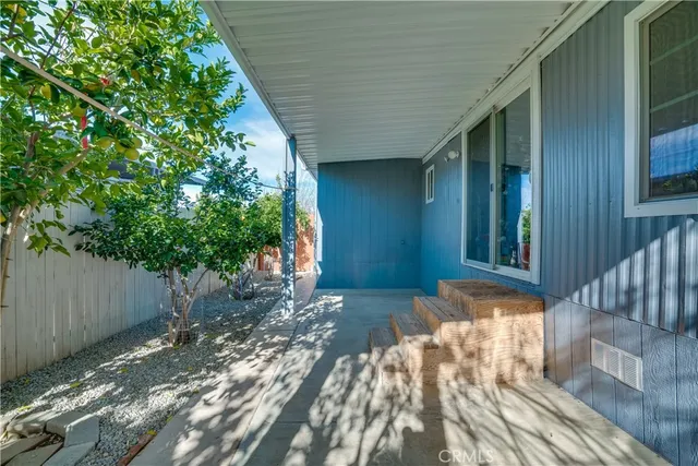 a view of backyard with a patio