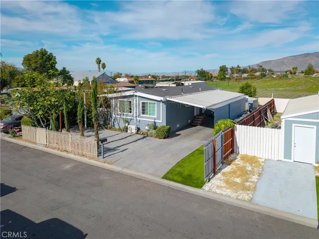 an aerial view of a house with a ocean view