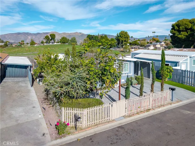 a view of a patio with a table and chairs