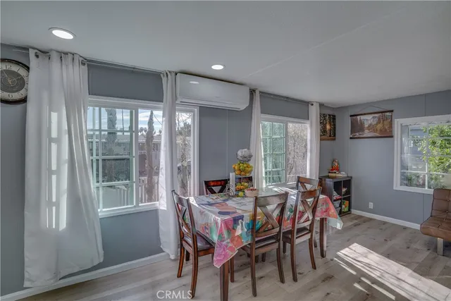 a view of a dining room with furniture window and outside view