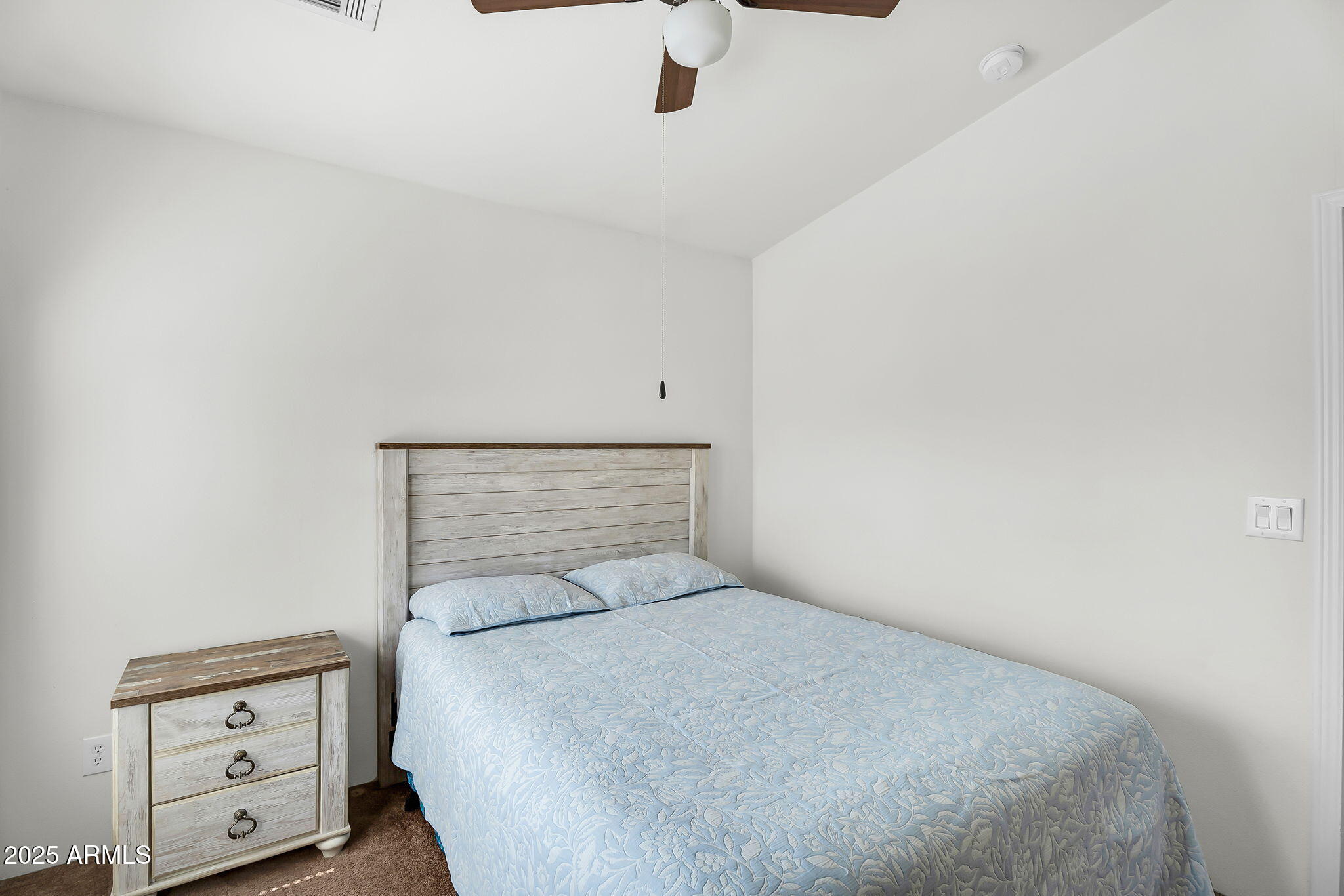 8865 East Baseline Road, Unit 802 Mesa, AZ 85209 - Photo 15 of 44 a bedroom with a bed and wooden floor