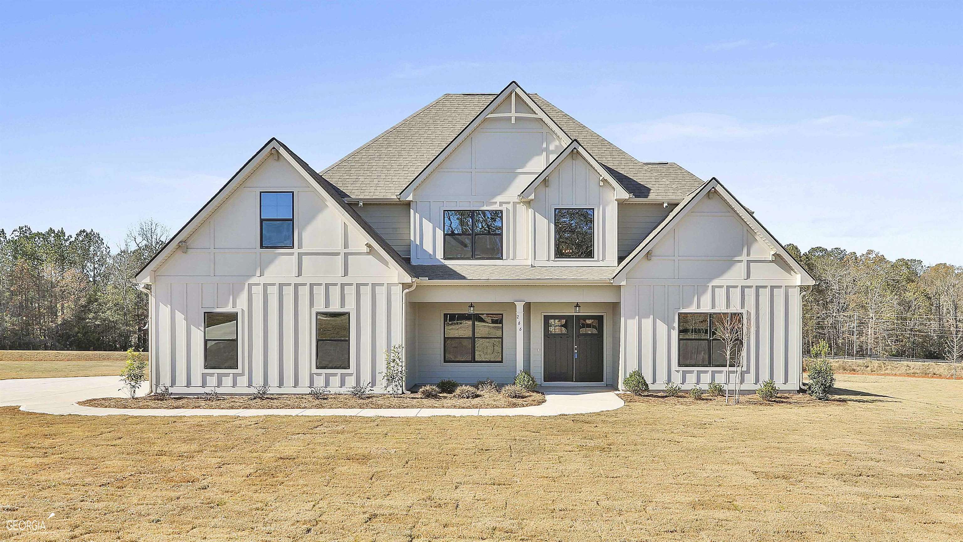 a front view of a house with a yard
