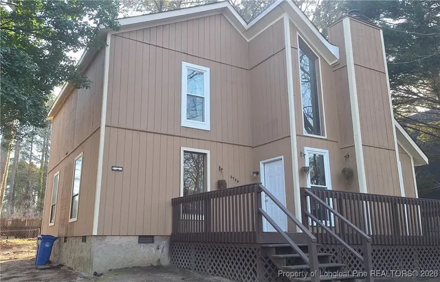a view of a house with a street
