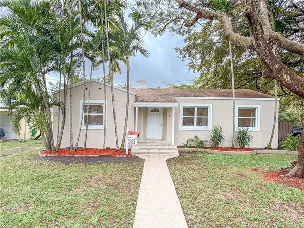 front view of a house with a yard
