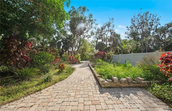 a view of a pathway both side of yard